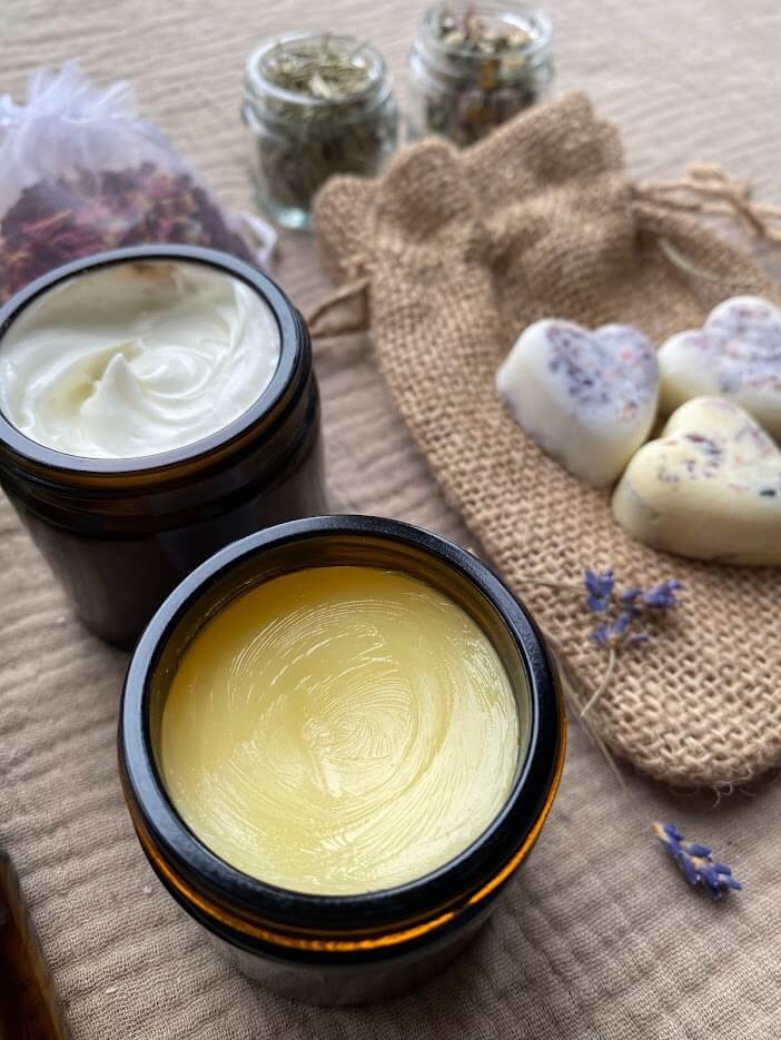 Skincare products in pots beside a hessian sack
